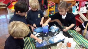Children creating fake snow 