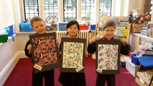 School children showing off their arty creations